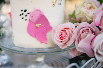 Small wedding cake with pink floral frosting