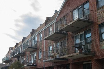 Fototapeta na wymiar Row of Generic Brick Apartment Buildings with Balconies in Astoria Queens New York