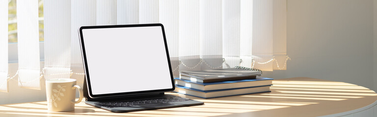 Laptop computer with white blank screen on desk in workspace and copy space concept
