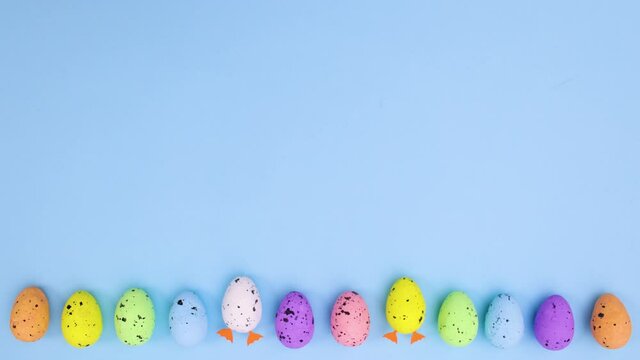 Easter eggs with different colors move down and eggs with legs move up. Stop motion