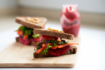  Natural vegetable sandwiches with horse radish sauce. In the background is a jar of leftover sauce. Copy space.