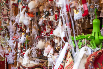 Beautiful decoration. Shopping on traditional Christmas market in european city. Illumination and decorations. Traditional christmas market in the historic center. Selective focus.