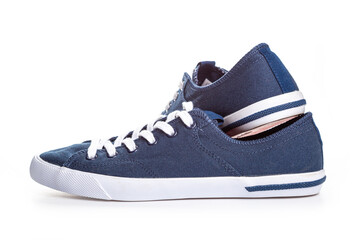 blue sneakers on white background with copy space. Youth shoes.