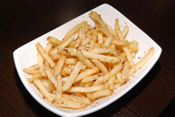 french fries in the white rectangle bowl