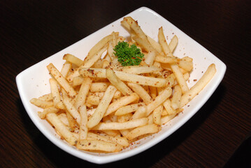 french fries in the white rectangle bowl