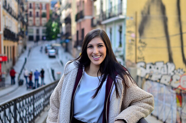 Fototapeta premium Pretty Woman with radiant smile in the city