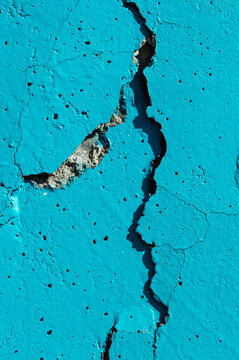 concrete wall with crack blue paint