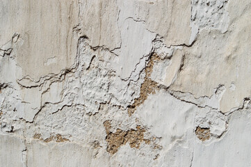 old wall, white paint, to peel, several layers