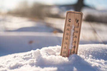 Thermometer in the winter. Under zero. Winter snowy country. 