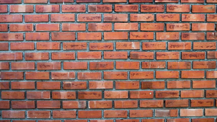 brick wall of red color, wide panorama of masonry.old red brick wall texture background.background of red harmonic brick wall..Texture of old dark brown and red brick wall panoramic backgorund