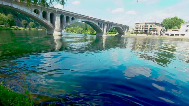 Look at the Pont du Chemin de Fer, railway bridge at Huy on a sunny summer day, above The Maas in Huy, Belgium, 4k, 50fps