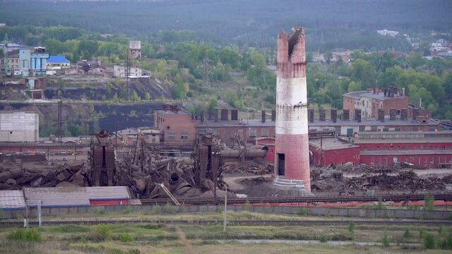 Explosion of old structures. Imploding works. Disposal of an obsolete metallurgical plant. Sound is present.