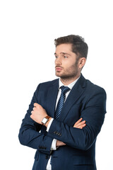pensive businessman with crossed arms looking away isolated on white