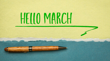 Hello March! Handwriting on a handmade paper with a stylish pen, cheerful greetings