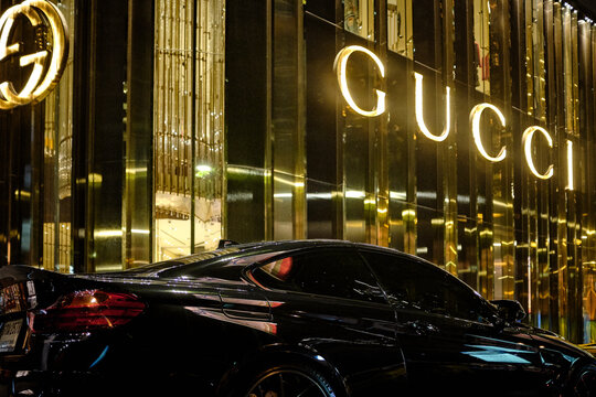 Bangkok, Thailand - April 04, 2018: a luxurious and expensive sports car is parked outside of the gucci store in the centre of the Thai capital Bangkok