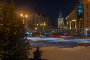 Night Lviv old city architecture in the winter season. Buildings highlighted by the illumination