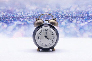 Retro alarm clock on a festive background