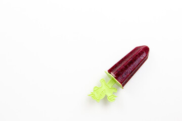 homemade homemade fruit and berry ice cream on a white background on sticks in the form of figurines