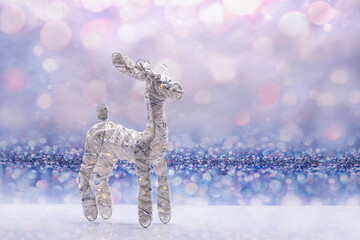 Glowing deer on a festive background. Christmas Concept