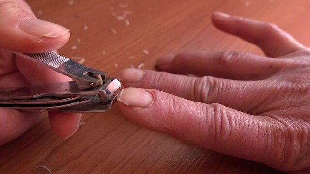 4K Self cutting of finger nails with a nail trimmer
