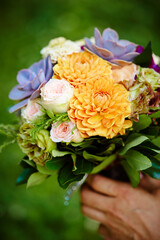bride holding bouquet of flowers