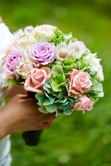 bride holding bouquet of flowers