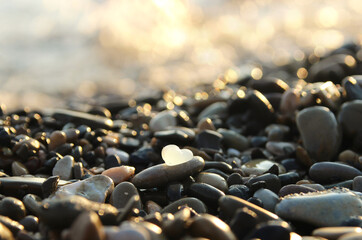 seashore and sunset, sea pebbles and glass.