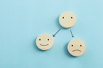Concept image of satisfaction level. wooden cubes with emotions