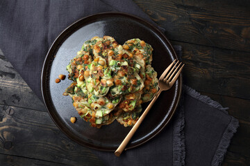Homemade vegetable pancakes with chickpea, zucchini and mint leaves