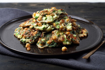 Homemade vegetable pancakes with chickpea, zucchini and mint leaves
