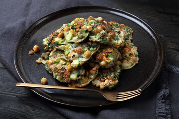 Homemade vegetable pancakes with chickpea, zucchini and mint leaves