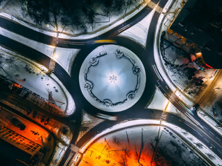 Night aerial view of roundabout road with circular cars in small european city © onphotoua