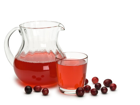 Glass jug and glass filled with cranberry berry juice