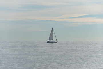 Sailing boat on the Black Sea at sunset in Sochi, Russia