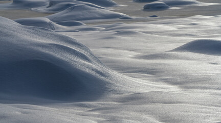 frozen snow covered rocks by winds