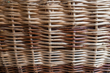 A wicker basket close up photo texture with shallow depth of field.