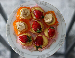 strawberry and banana dessert, plate on the table
