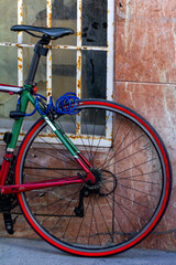Colored bicycle leaning on the wall