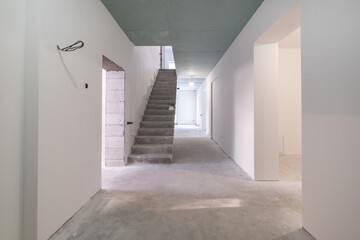 empty white room with concrete stair without repair and furniture
