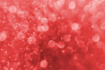 Red bokeh abstract background. Macro sparkle creates bubble background effect.