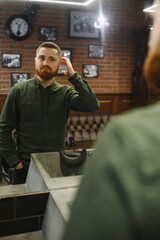 Barber at work. Collage of handsome bearded man getting haircut and beard grooming at barbershop