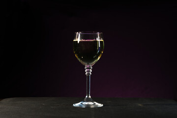 wine glasses with wine on black background 