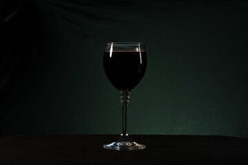 wine glasses with wine on black background 