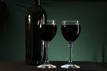 wine glasses with wine on black background 
