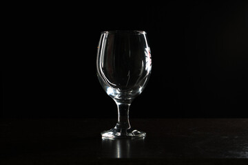 empty beer glass on black background