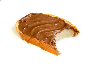 Slice of toast with chocolate hazelnut spread on isolated background