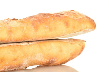 Two delicious freshly baked French baguettes, close-up, isolated on white.
