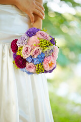 bride holding bouquet of flowers