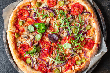 vegetable pizza tomato, pickles, mushroom, olives vegan or vegetarian no meat on the table healthy snack top view copy space food background