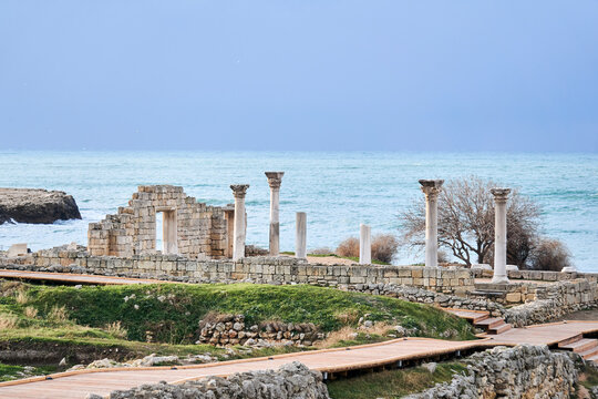 ruins of antique greek temple with columns on the seashore in Chersonesos